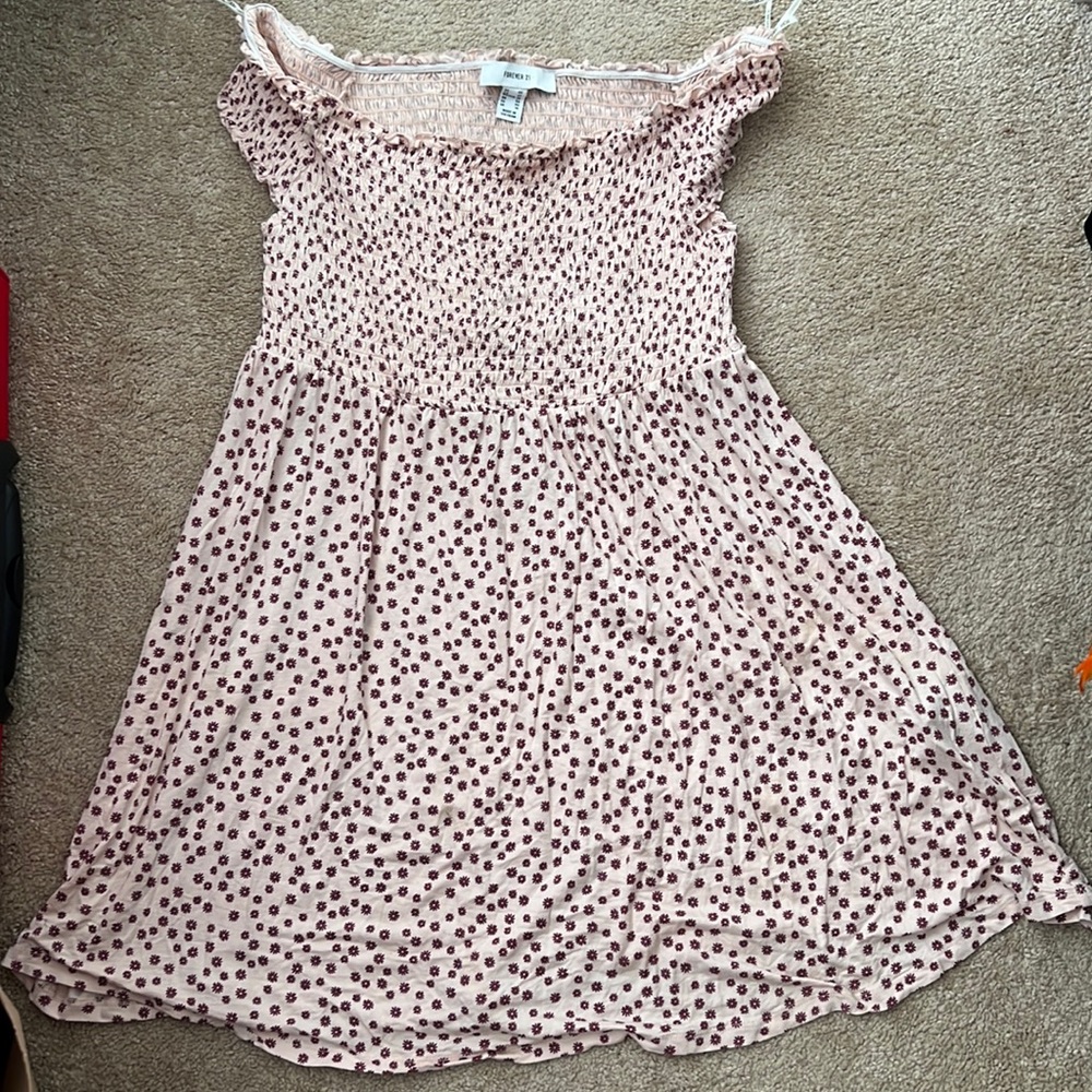 A cute summer dress with smocked neckline. It is from forever 21 +